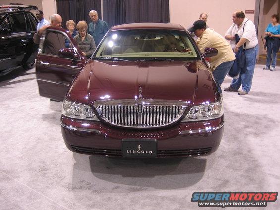 Maroon Lincoln Town Car front view with grille and Lincoln badging