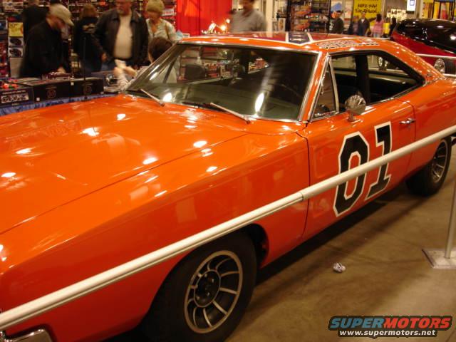Orange 1969 Dodge Charger with "01" on the doors and roof, seen from the front 3/4 angle