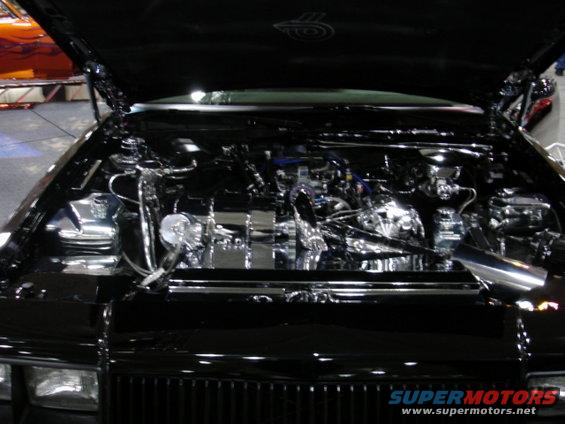 Black engine bay with chrome components and exposed engine