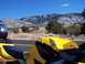 2000 Honda CBR-RR - A yellow and black motorcycle with the Honda logo is parked on the side of a road, with a scenic mountain landscape behind it.