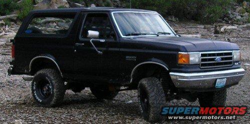 Black 1990 Ford Bronco 3q-front view with lifted suspension
