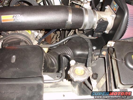 K&N air intake tube and filter assembly connected to engine throttle body