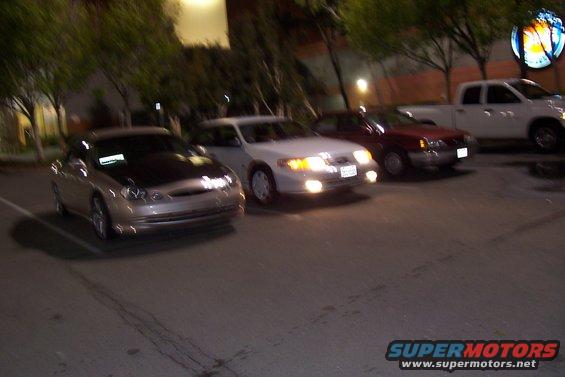 Silver coupe with black hood, 1998 Mercury Sable