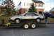 1981 Ford Mustang - A 1981 Ford Mustang RS Turbo is loaded onto a trailer in front of a house.