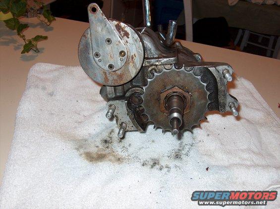 motorcycle transmission with sprocket and brake mechanism