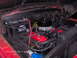 1960 Ford F-100 - Engine bay of a classic truck, likely a 1956 Ford F-100, showing the V8 engine and battery.