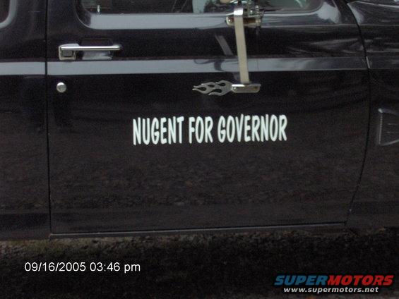Black truck door with white text "NUGENT FOR GOVERNOR" and a flame decal