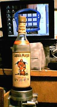 captmorgan.jpg Old laptop sitting on a Kleenex box, and 55mm MAF housing as a cupholder.