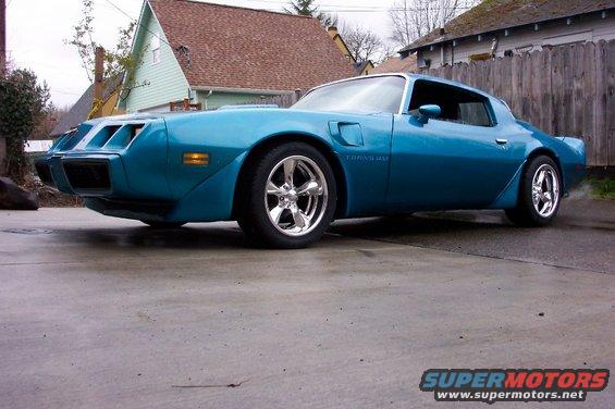 Blue 1979 Pontiac Trans Am 3/4 front view with chrome wheels