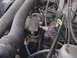 1995 Ford Mustang - Close-up view of an engine bay, showing various components and hoses.