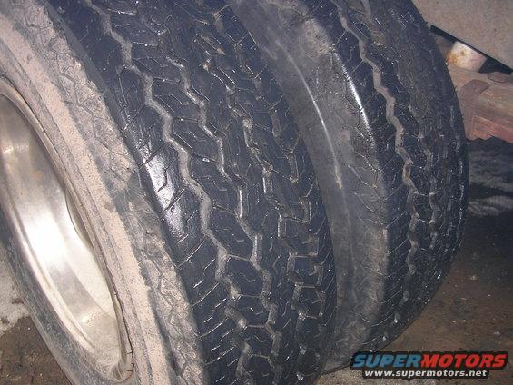 Dual rear tires on a vehicle, close-up view