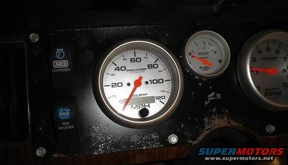Dashboard with speedometer, fuel gauge, and RPM gauge. Also has ARB compressor and rear air locker switches