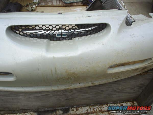 White 1996 Ford Thunderbird grille with honeycomb pattern and chrome emblem