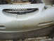 1996 Ford Thunderbird - The front grille of a 1996 Ford Thunderbird shows its distinctive honeycomb pattern and emblem.