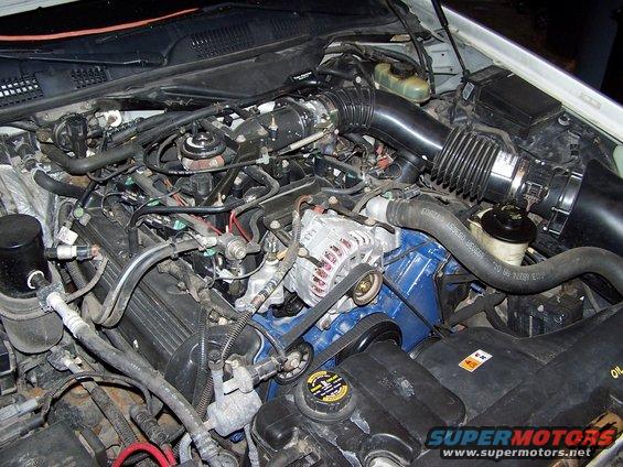 2000 Ford Crown Victoria engine bay with V8 engine, alternator, and air intake system