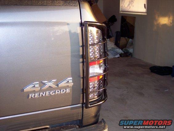 Close-up of a Jeep Renegade's tail light with a 4x4 badge on the side