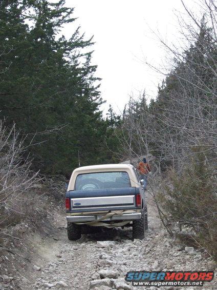 Rear view of a 1986 Ford Bronco on a rocky trail