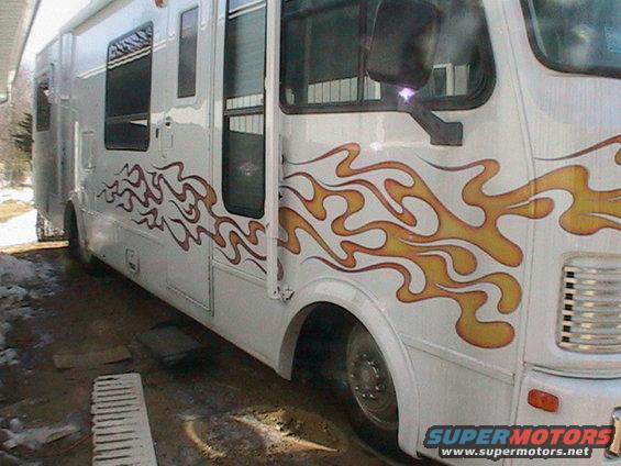 motorhome with yellow and orange flame decals on the side
