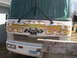 1977 Ford F-250 - This RV's front end is decorated with flames, a skull, and checkered flags.