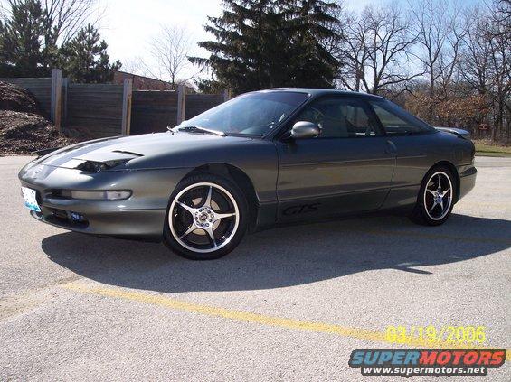 Dark grey 1995 Ford Probe GTS coupe with aftermarket rims