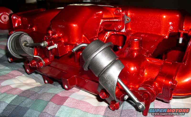 Red intake manifold with two actuators, close-up view