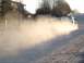 1994 Ford Probe - A car kicks up a large cloud of dust as it drifts on a dirt road.