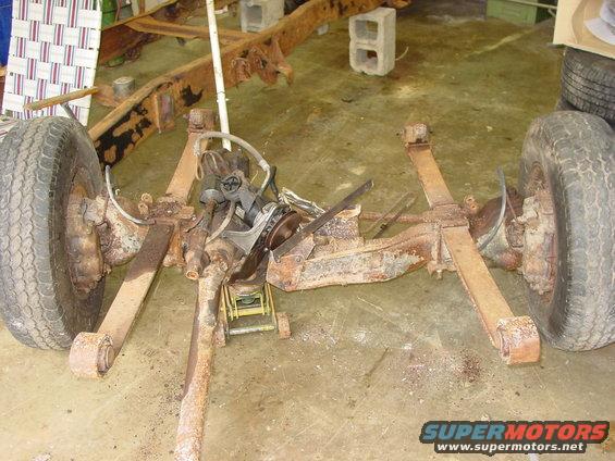Rusted truck chassis and suspension with wheels
