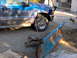 1995 Ford F-250 - Blue Ford F-250 truck with a snow plow attached. The truck appears to be from the late 1990s or early 2000s.