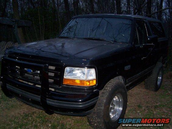 1992 Ford Bronco parked outdoors at dusk, front 3/4 view