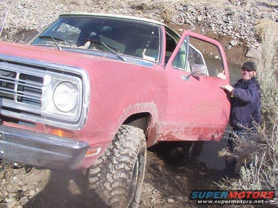 Red 1970s Dodge Ramcharger off-roading
