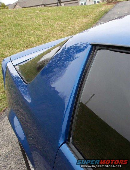 Blue 1990 Chevrolet Camaro rear quarter panel and window