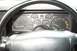 1990 Chevrolet Camaro - Interior view of a car's dashboard, showing various gauges and the steering wheel. The odometer displays 074555 miles.