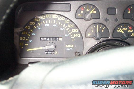 1990 Chevrolet Camaro dashboard gauges with odometer reading 69455.3