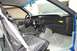1990 Chevrolet Camaro - The interior of a 1990 Chevrolet Camaro Z28, showing the dashboard and driver's seat with a cover.