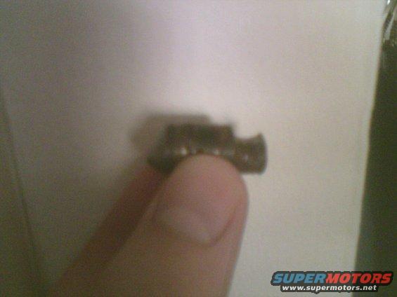 Metal part held by a finger