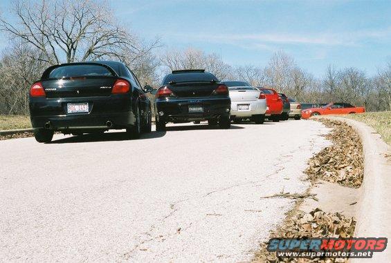 Black 2004 Dodge SRT-4 rear view, parked in a line with other cars