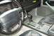 1990 Chevrolet Camaro - The interior of a 1990 Chevrolet Camaro shows the steering wheel, dashboard gauges, and automatic transmission shifter.