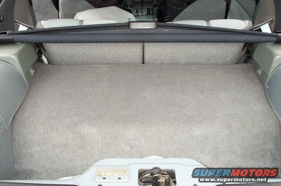 1990 Chevrolet Camaro trunk interior with grey carpet and cargo cover