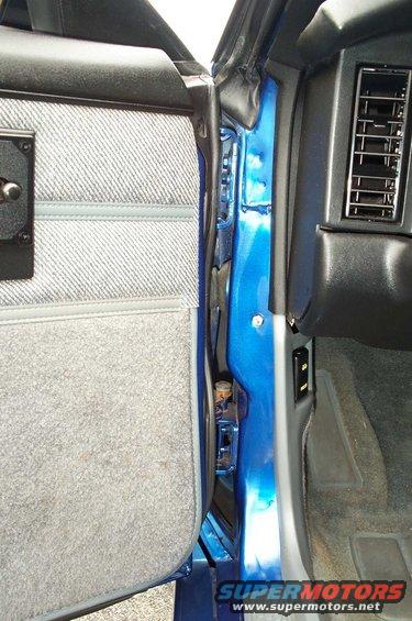 Blue 1990 Chevrolet Camaro interior door jamb and air vent