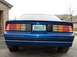 1990 Chevrolet Camaro - Rear view of a blue 1990 Chevrolet Camaro, showing its distinctive taillights and IROC-Z badging.