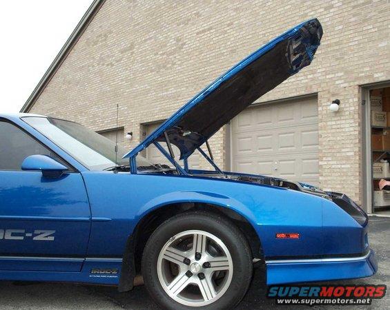Blue Chevrolet Camaro IROC-Z with hood open, showing side and front quarter panel