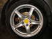 1996 Ford Probe - Close-up of a car's wheel, showing the alloy rim and brake components.