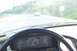 1994 Ford F-150 - Driving down a road with another vehicle in front, seen from the driver's perspective.