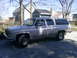 1985 Ford Bronco - This GMC Suburban is parked in front of a residential house on a sunny day.