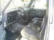 1985 Ford Bronco - Interior view of a truck, showing the dashboard, steering wheel, and seats.
