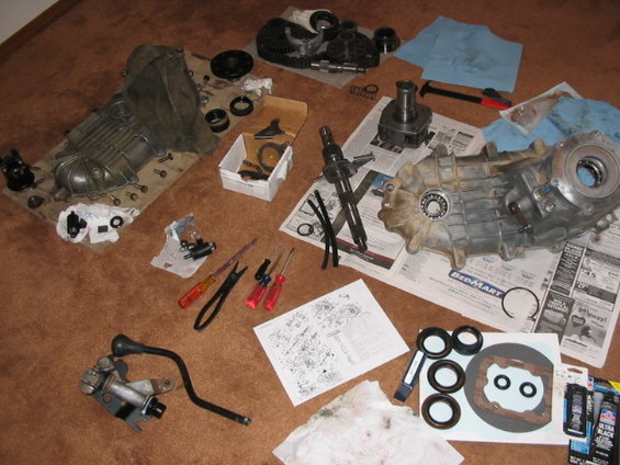 109_0983.jpg pretty much all disasembled, cleaned the one half, reusing the bearings, but it is getting new seals, new oil pump kit, the welded piece of round rod on the oil pump locator arm, and new shift fork inserts.  scored the shifter assembly and shifter, still need the boot/plastic cover and linkage rod, and short electrical harness to try and get the dash lights to work