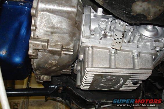 Close-up of a transmission bell housing and oil pan with Ford logo