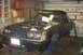 1981 Ford Mustang - This 1981 Ford Mustang is in a garage, appearing to be undergoing maintenance or repairs with its hood up and front wheels off.