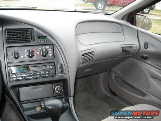 Interior dashboard with digital clock showing 20:01 and aftermarket stereo