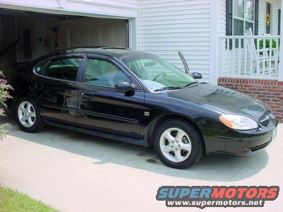 right_side.jpg 2000 Midnight Black Ford Taurus SES 4-Door Sedan - Right Side